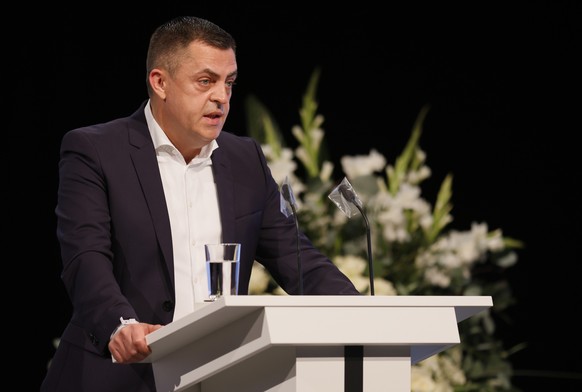 epa09024457 Armin Kurtovic, father of the killed Hamza Kurtovic, speaks during a memorial ceremony for the anniversary of the shooting by a right-wing extremist in February 2020, in Hanau, Germany, 19 ...