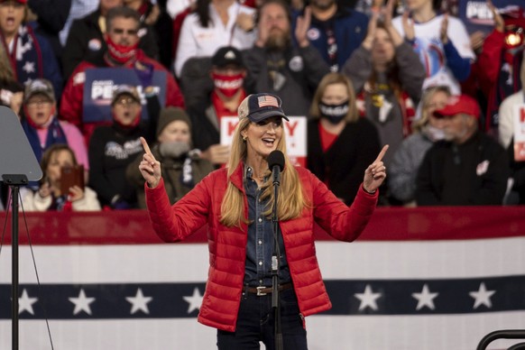 RETRANSMISSION TO CORRECT SPELLING OF PURDUE TO PERDUE - U.S. Sen. Kelly Loeffler, R-Ga., addresses the crowd during a rally with U.S. Sen. David Perdue, R-Ga., Saturday, Dec. 5, 2020 in Valdosta, Ga. ...