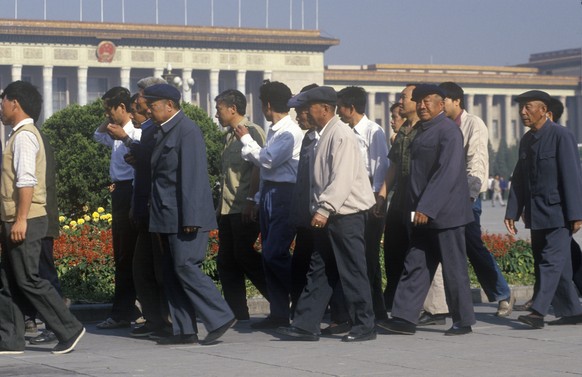 Chinesische Arbeiter im Mao-Einheitslook.