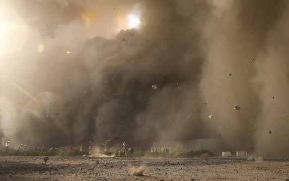Debris flies toward the launch pad as SpaceX's Starship launches from Starbase in Boca Chica, Texas, Thursday, April 20, 2023. (Jon Shapley/Houston Chronicle via AP)