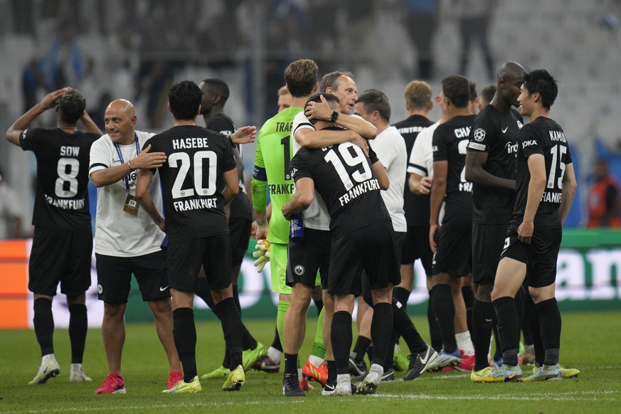 Frankfurt players celebrate at the end of the Champions League group D soccer match between Marseille and Frankfurt at the Velodrome stadium in Marseille, southern France, Tuesday, Sept. 13, 2022. Fra ...