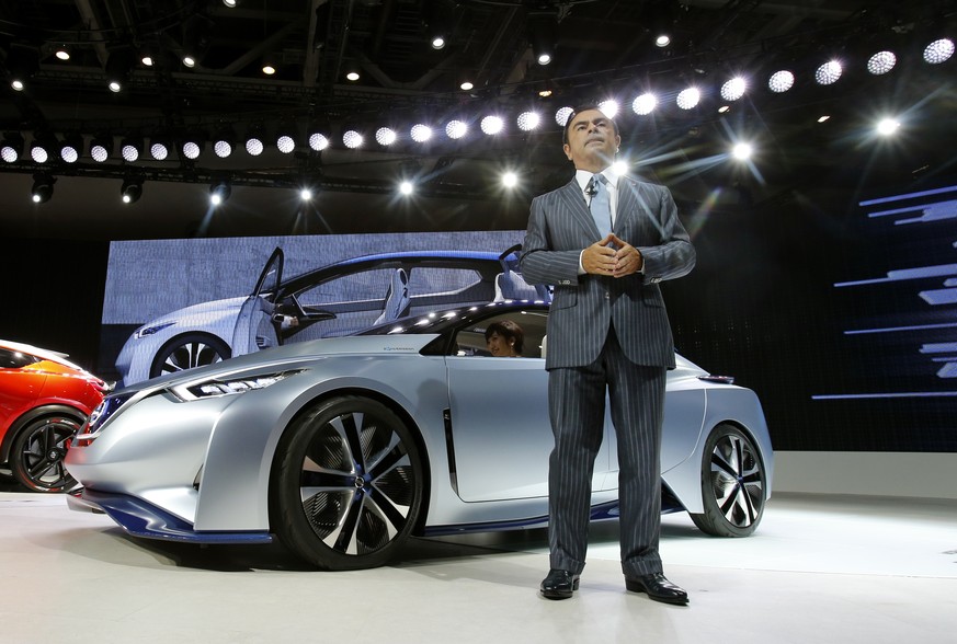 Nissan Motor Co. President and CEO Carlos Ghosn speaks as he unveils the Nissan IDS concept vehicle, which features self-driving and zero emission, during the media preview of the Tokyo Motor Show in  ...