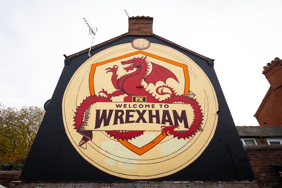 epa10989610 The ?Welcome to Wrexham? mural near to the Stok Cae Ras stadium in Wrexham, Britain, 22 November 2023. Wrexham AFC is set to take over the lease to the club?s Racecourse Ground stadium (kn ...