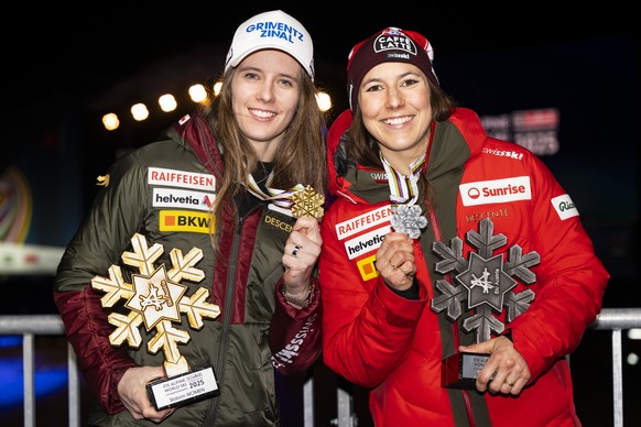 Gold medalist Camille Rast of Switzerland, left, and Silver medalist Wendy Holdener of Switzerland, right, pose during the medals ceremony of the women&#039;s Slalom race at the 2025 FIS Alpine World  ...