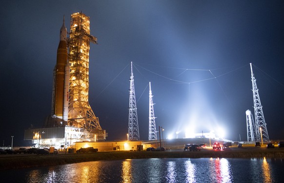 epa10285707 A handout photo made available by NASA shows NASA&#039;s Space Launch System (SLS) rocket with the Orion spacecraft aboard is seen atop the mobile launcher as Crawler Transporter-2 (CT-2)  ...