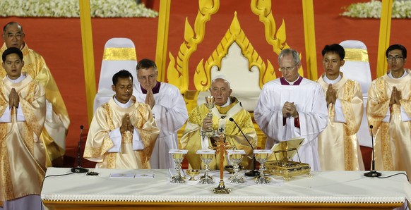 Pope Francis, center, celebrates an open-air Mass at national sports stadium in Bangkok, Thailand, Thursday, Nov. 21, 2019. Pope Francis urged more efforts to combat the &quot;humiliation&quot; of wom ...