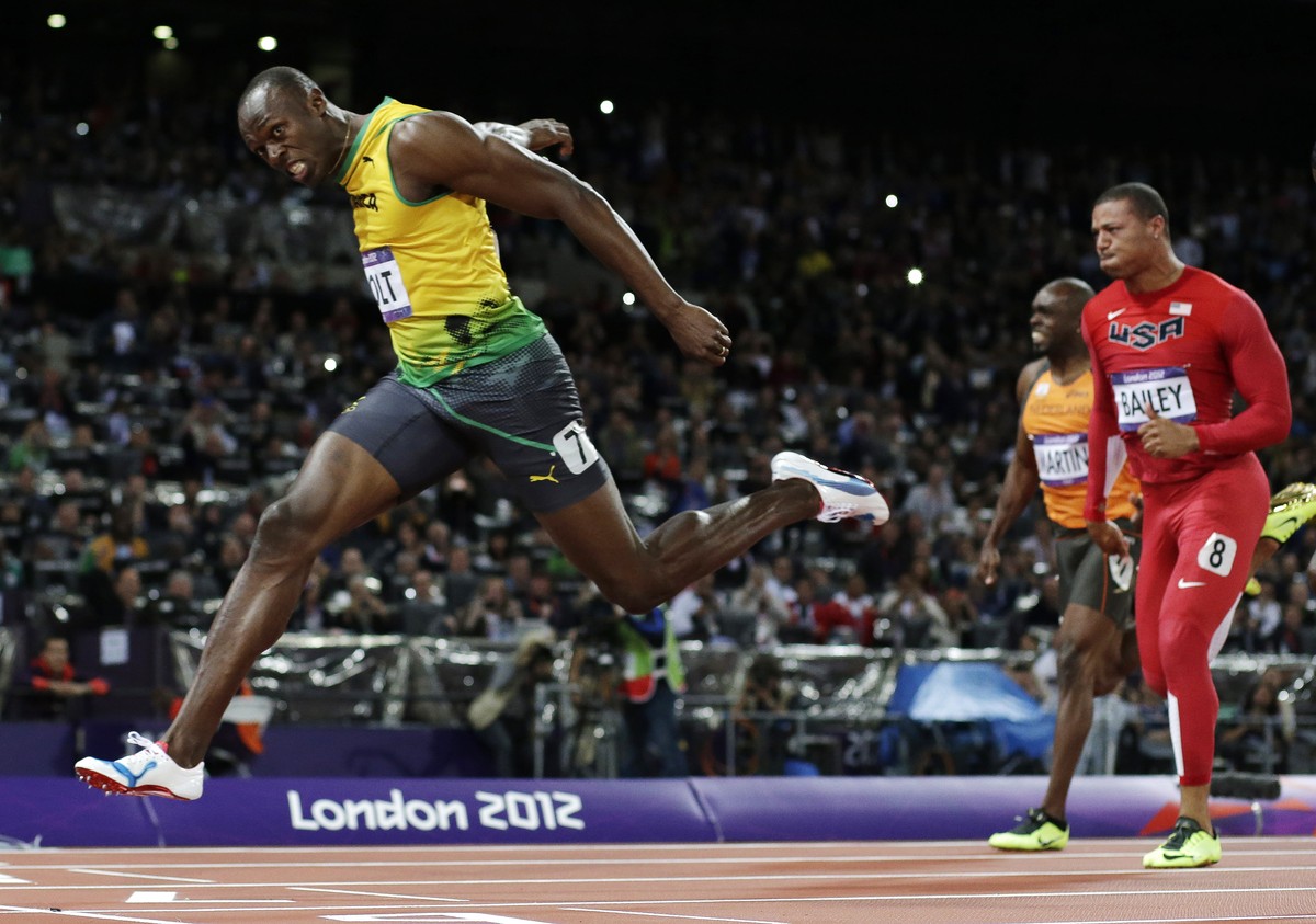 FILE - In this Aug. 5, 2012, file photo, Jamaica's Usain Bolt crosses the finish line to win gold in the men's 100-meter final in the Olympic Stadium at the 2012 Summer Olympics in London. ( ...