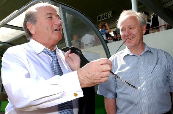 FIFA president Joseph Blatter, left, speaks with Swiss coach Jakob Kuhn, right, before a gala football match Swiss Stars vs All Star Team, selected by FIFA, at the Swiss national exhibition, Expo.02,  ...