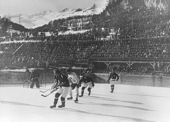 19 Feb 1928: The Canadian and Swiss teams in action during a match in the Ice Hockey event at the 1928 Winter Olympic Games in St. Moritz, Switzerland. Canada won the match 13-0 and went on to win the ...