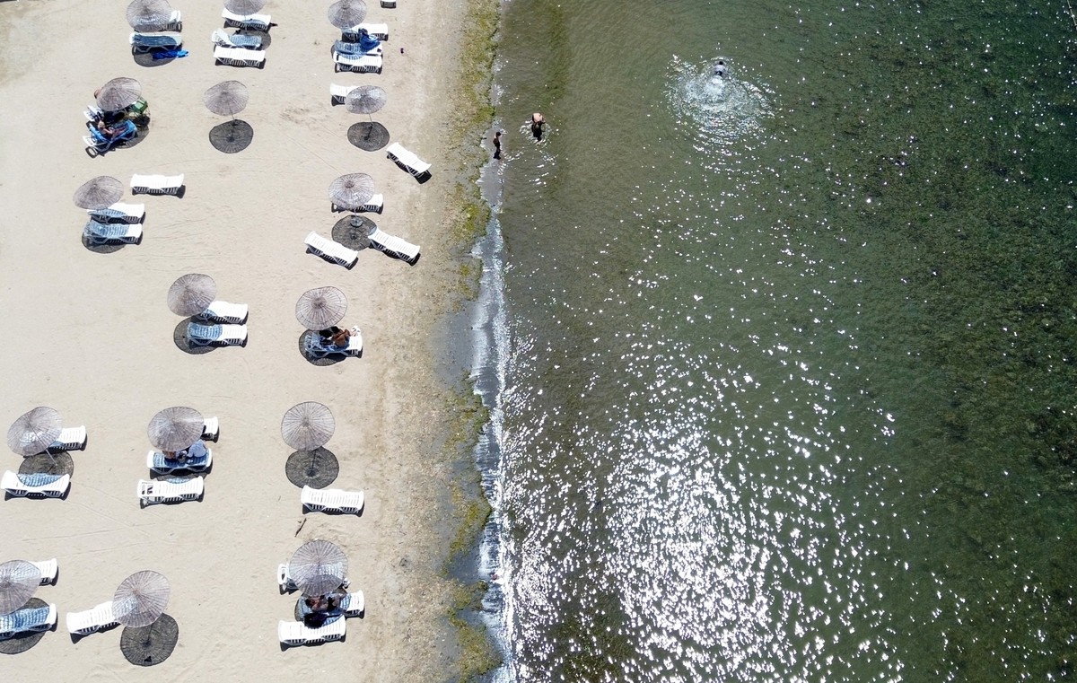 epa11515520 A picture taken with a drone shows people enjoying a day at the beach near the Marmara Sea in Istanbul, Turkey, 31 July 2024 (issued 01 August 2024). The Turkish Statistical Institute (T