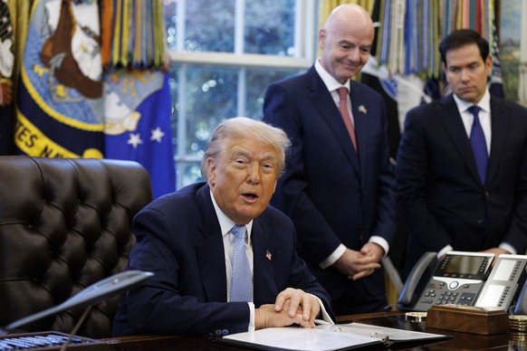 epa12532461 US President Donald Trump (L) speaks next to FIFA President Gianni Infantino (2-R) and US Secretary of State Marco Rubio (R) during a meeting with the White House Task Force on the FIFA Wo ...