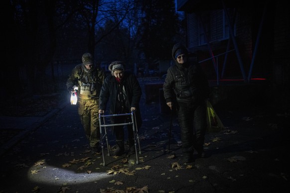 Elderly residents are evacuated from the southern city of Kherson, Ukraine, Sunday, Nov. 27, 2022. Shelling by Russian forces struck several areas in eastern and southern Ukraine overnight as utility  ...