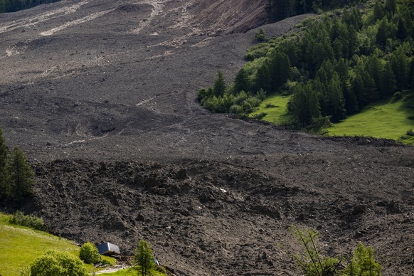 epa12142516 A general view of the village of Blatten buried under mud and rocks after a massive avalanche triggered by the collapse of the Birch Glacier, Switzerland, 29 May 2025. One person went miss ...