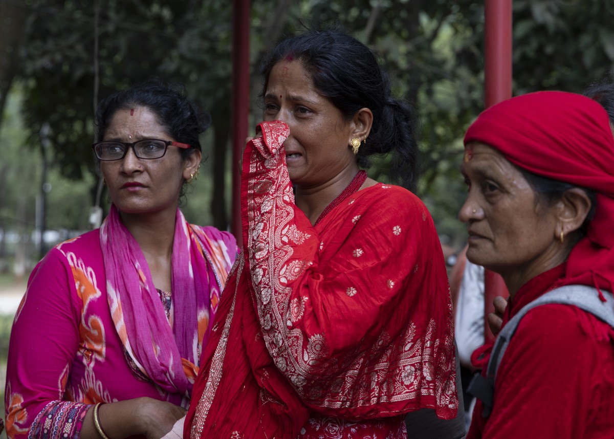 epa13193038 Local people gather outside the hospital following a flash flood in Trishuli Bazar, Nuwakot district, Nepal, 26 August 2026. Several people were killed, and multiple others were reported m ...