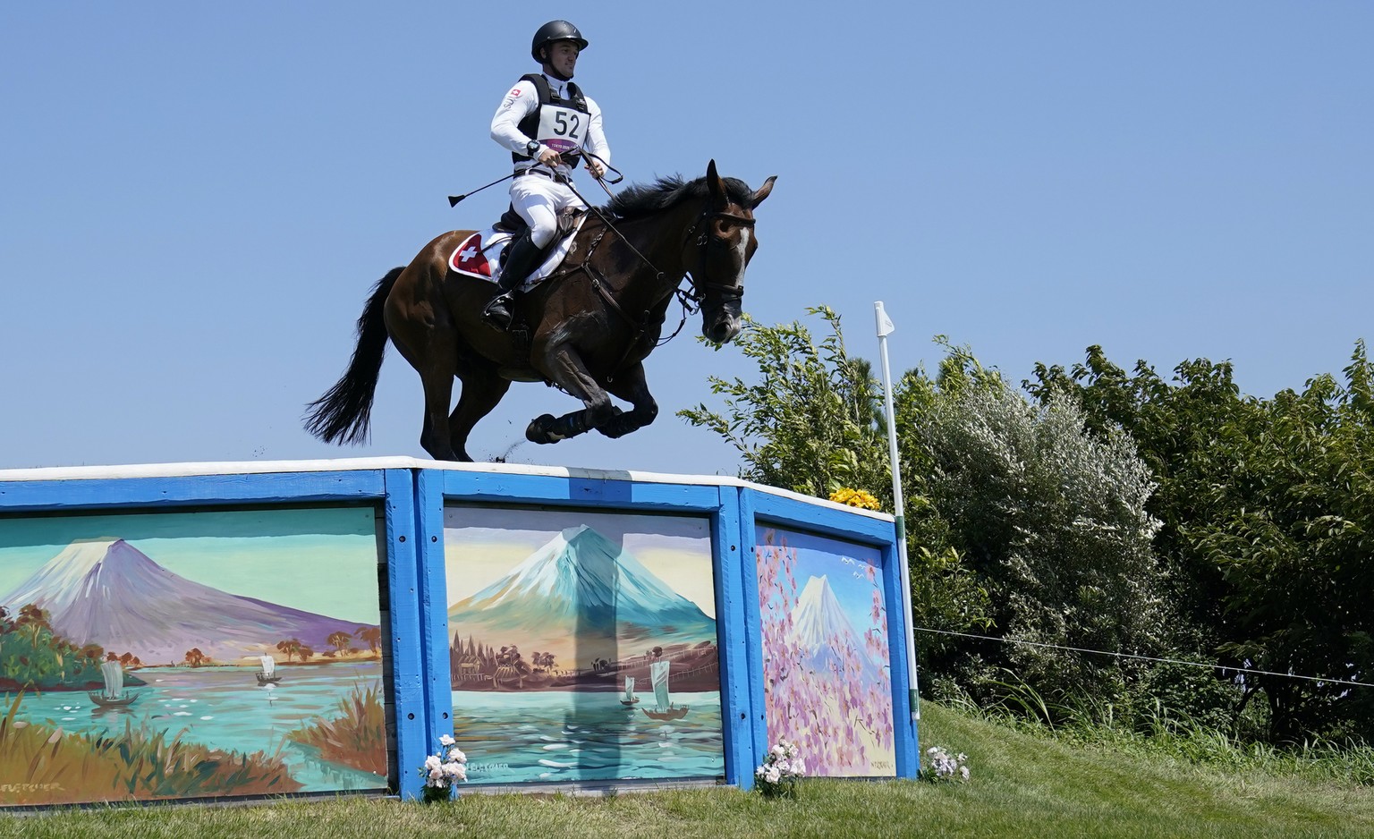 Switzerland&#039;s Robin Godel, riding Jet Set, competes during the Equestrian Eventing Cross Country competition at the Sea Forest Cross Country Course during the 2020 Summer Olympics, Sunday, Aug. 1 ...