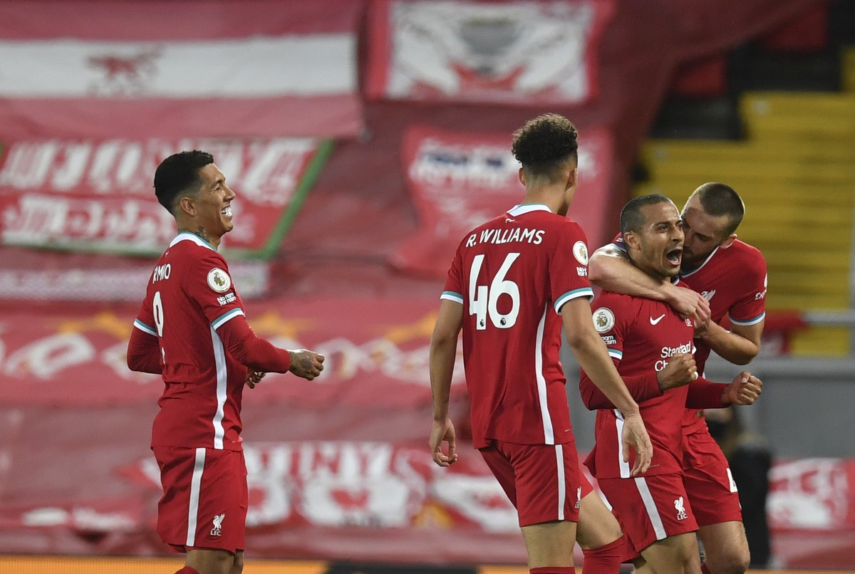 Liverpool's Thiago, second right, celebrates with teammates after scoring his side's second goal during the English Premier League soccer match between Liverpool and Southampton at Anfield s ...