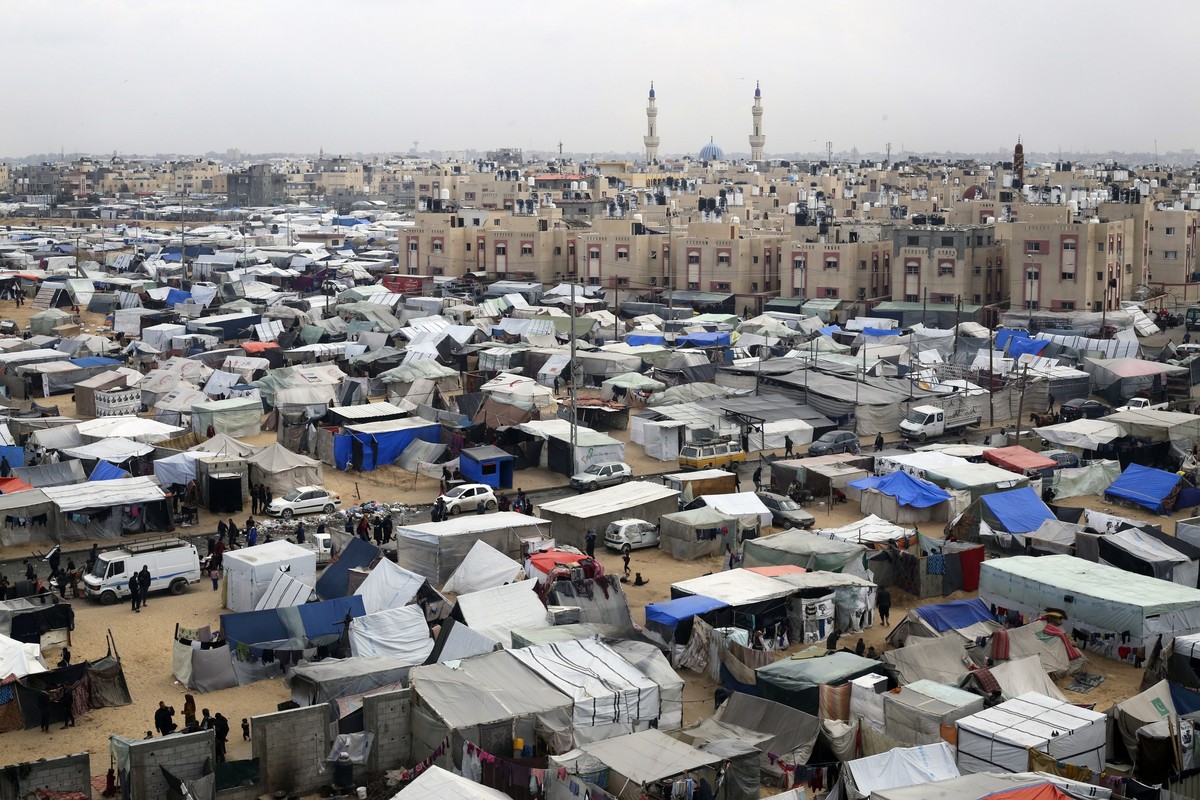 FILE - A tent camp housing Palestinians displaced by the Israeli offensive is seen in Rafah, Gaza Strip, on Feb. 27, 2024. The tent camps stretch for more than 16 kilometers (10 miles) along Gaza?s co ...