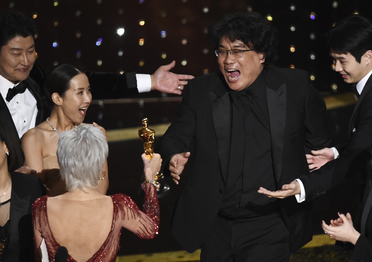 Bong Joon Ho, right, reacts as he is presented with the award for best picture for "Parasite" from presenter Jane Fonda at the Oscars on Sunday, Feb. 9, 2020, at the Dolby Theatre in Los Ang ...