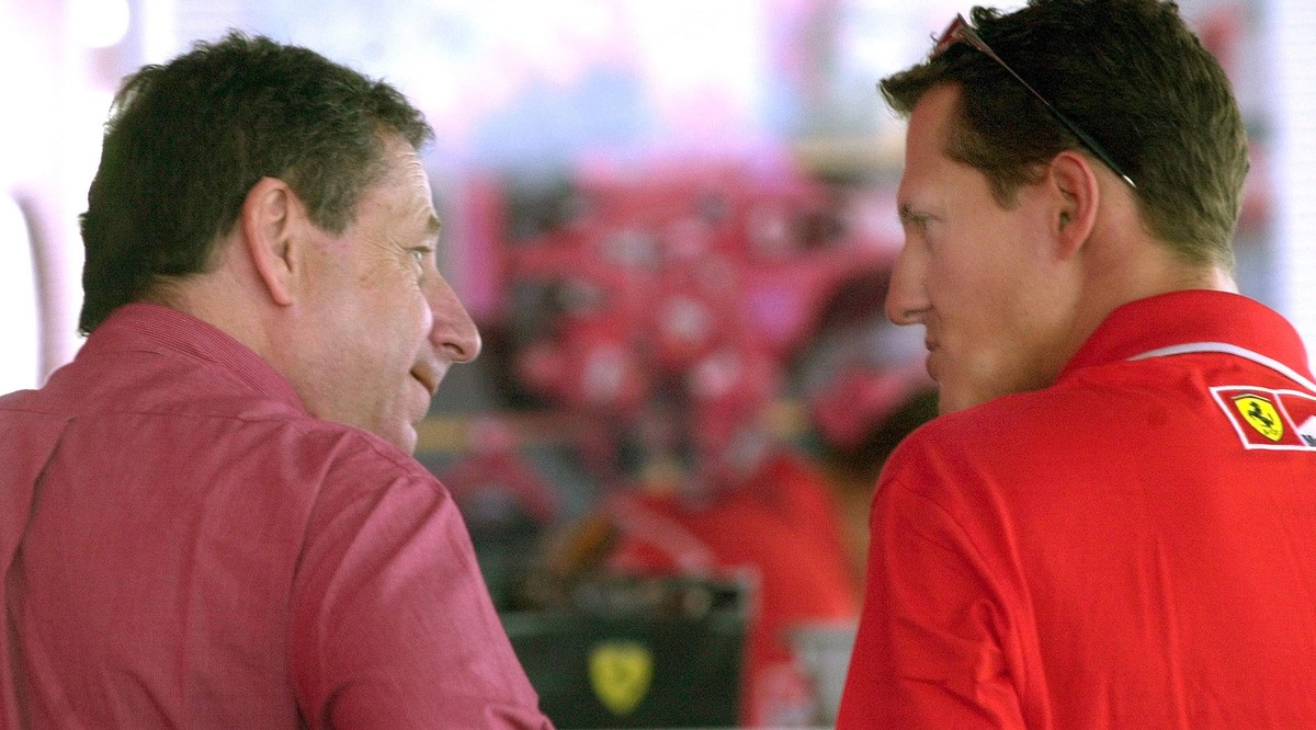 Germany's Michael Schumacher, right, talks to Ferrari team manager Jean Todt in Budapest, Thursday Aug. 16, 2001, prior to Sunday's Hungarian Grand Prix. Schumacher needs to take three point ...