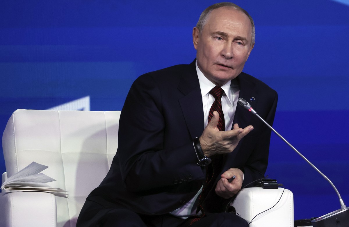 epa11708566 Russian President Vladimir Putin attends a plenary session as part of the 21st annual meeting of the Valdai Discussion Club titled 'Lasting peace on what basis? Common security and eq ...