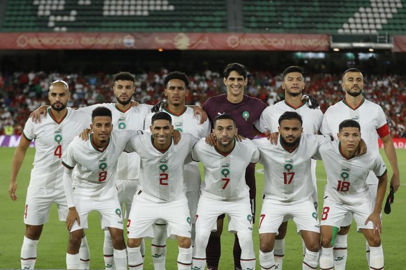 The Moroccan national soccer team players pose for photos before the international friendly soccer match between Paraguay and Morocco at the Benito Villamarin stadium in Seville, Spain, Tuesday, Sept. ...