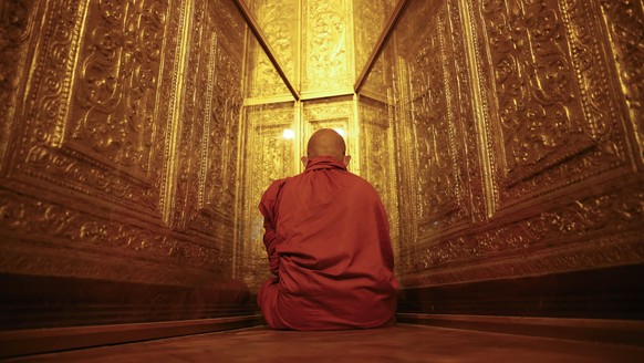 epa05983942 A Buddhist monk meditates in a corner of the Botataung Pagoda in Yangon, Myanmar, 23 May 2017. Myanmar&#039;s State Sangha (monastic community of ordained Buddhist monks or nuns) committee ...