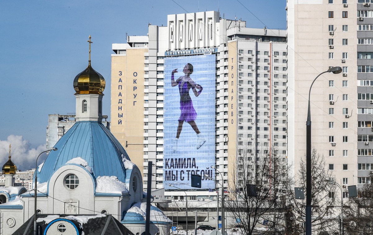 epa09755495 A billboard showing Russia's Kamila Valieva reads ?Kamila, we are with you!? in Moscow, Russia, 14 February 2022. The 15-year-old Russian Olympic skater, who failed a pre-games drug t ...