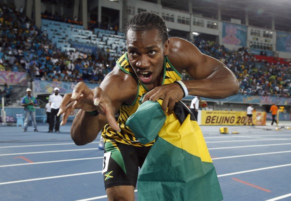 Jamaica&#039;s Yohan Blake poses for photographers after Jamaica set a new world record in winning the 4x200 metres relay at the IAAF World Relays Championships in Nassau, Bahamas, May 24, 2014. Olymp ...