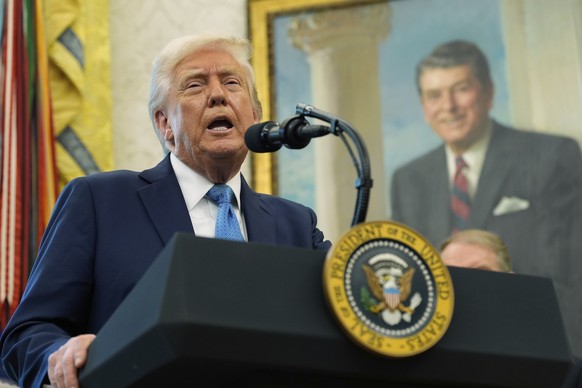 President Donald Trump speaks with reporters as he participates in a ceremonial swearing in of Paul Atkins as chairman of the Securities and Exchange Commission, in the Oval Office of the White House, ...