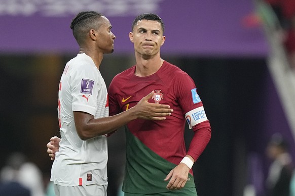 Portugal&#039;s Cristiano Ronaldo cheers with Switzerland&#039;s Manuel Akanji at the end of the World Cup round of 16 soccer match between Portugal and Switzerland, at the Lusail Stadium in Lusail, Q ...