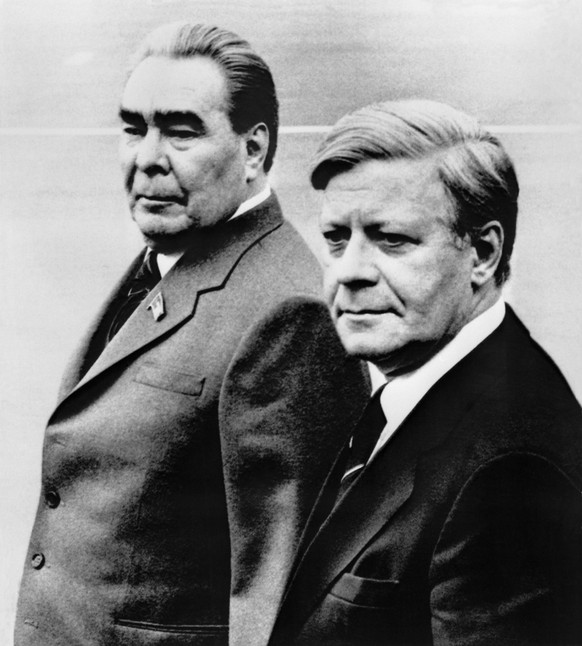 West German Chancellor Helmut Schmidt, right, is welcomed by Soviet Party leader Leonid Brezhnev, upon his arrival at the airport in Moscow, Russia on Monday, June 30, 1980 for a two-day official visi ...
