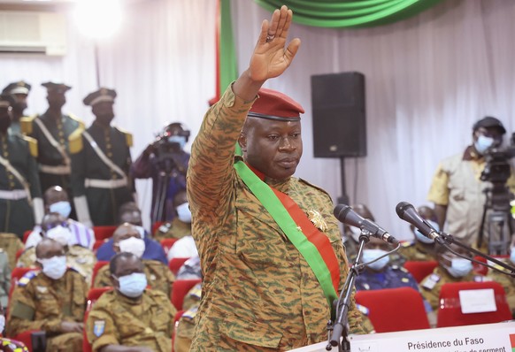 epa10215796 (FILE) Lieutenant Colonel Paul-Henri Damiba being sworn in as head of state during a ceremony held in Ouagadougou, Burkina Faso, 16 February 2022 (reissued 30 September 2022). Gunshots hav ...