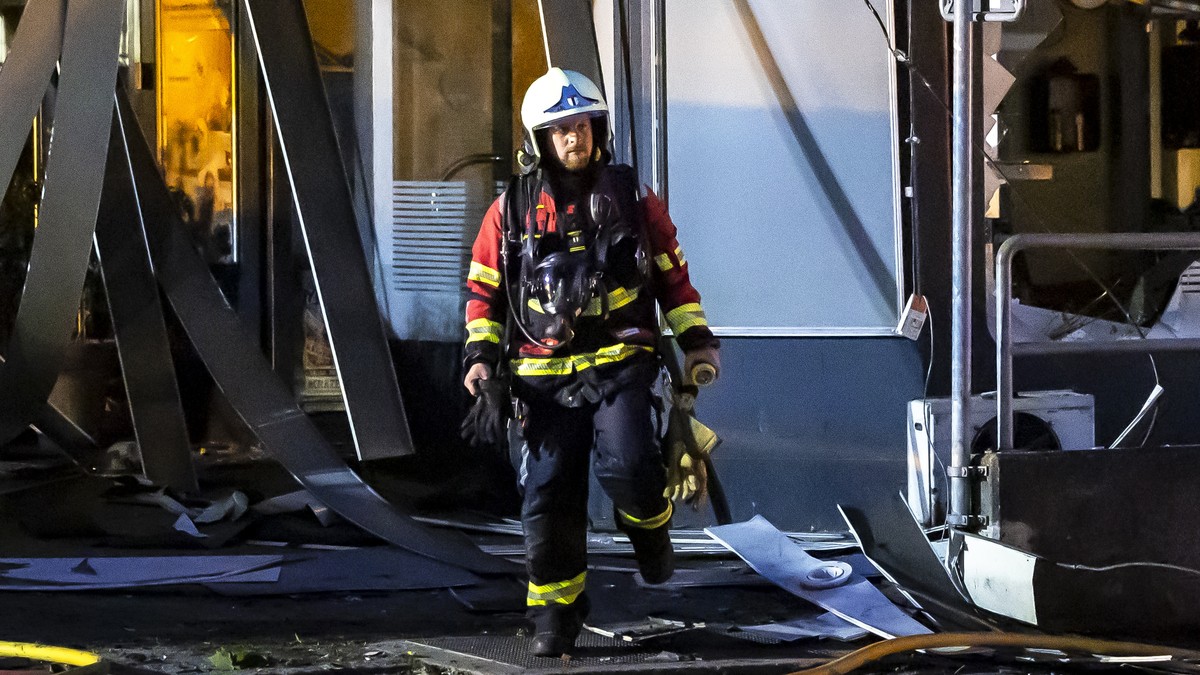 epa11409058 Firefighters work at Markthof Nussbaumen after an explosion in an underground car park and a subsequent fire in a high-rise building in Nussbaumen, Switzerland, 13 June 2024 (issued 14 Jun ...