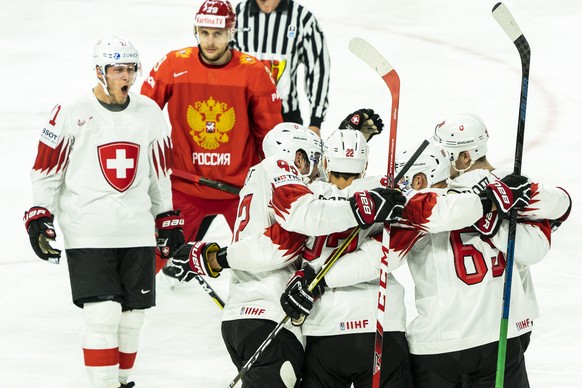 epa06732094 Switzerland celebrates a goal during the IIHF World Championship Group A Ice Hockey match between Russia and Switzerland in Royal Arena in Copenhagen, Denmark, 12 May 2018. EPA/MARTIN SYLV ...