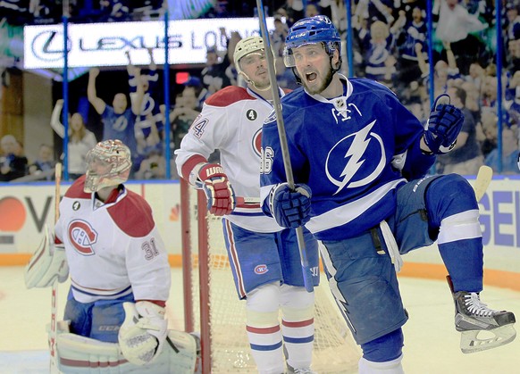 Tampa Bay Lightning right wing Nikita Kucherov (86) celebrates as he beats Montreal Canadiens goalie Carey Price (31) to score the first goal of the game during the first period of Game 6 of a second- ...