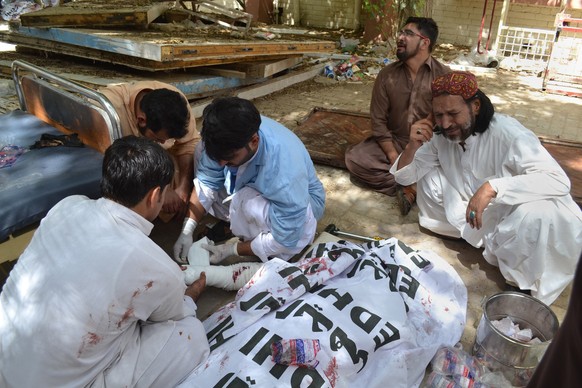 A Pakistani man mourns the death of a family member who was killed in a bomb blast, in Quetta, Pakistan, Monday, Aug. 8, 2016. A powerful bomb went off inside a government-run hospital in the southwes ...