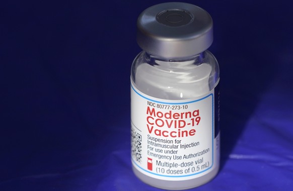 FILE - In this March 4, 2021 file photo, a vial of the Moderna COVID-19 vaccine rests on a table at a drive-up mass vaccination site in Puyallup, Wash., south of Seattle. COVID-19 vaccine sales helped ...