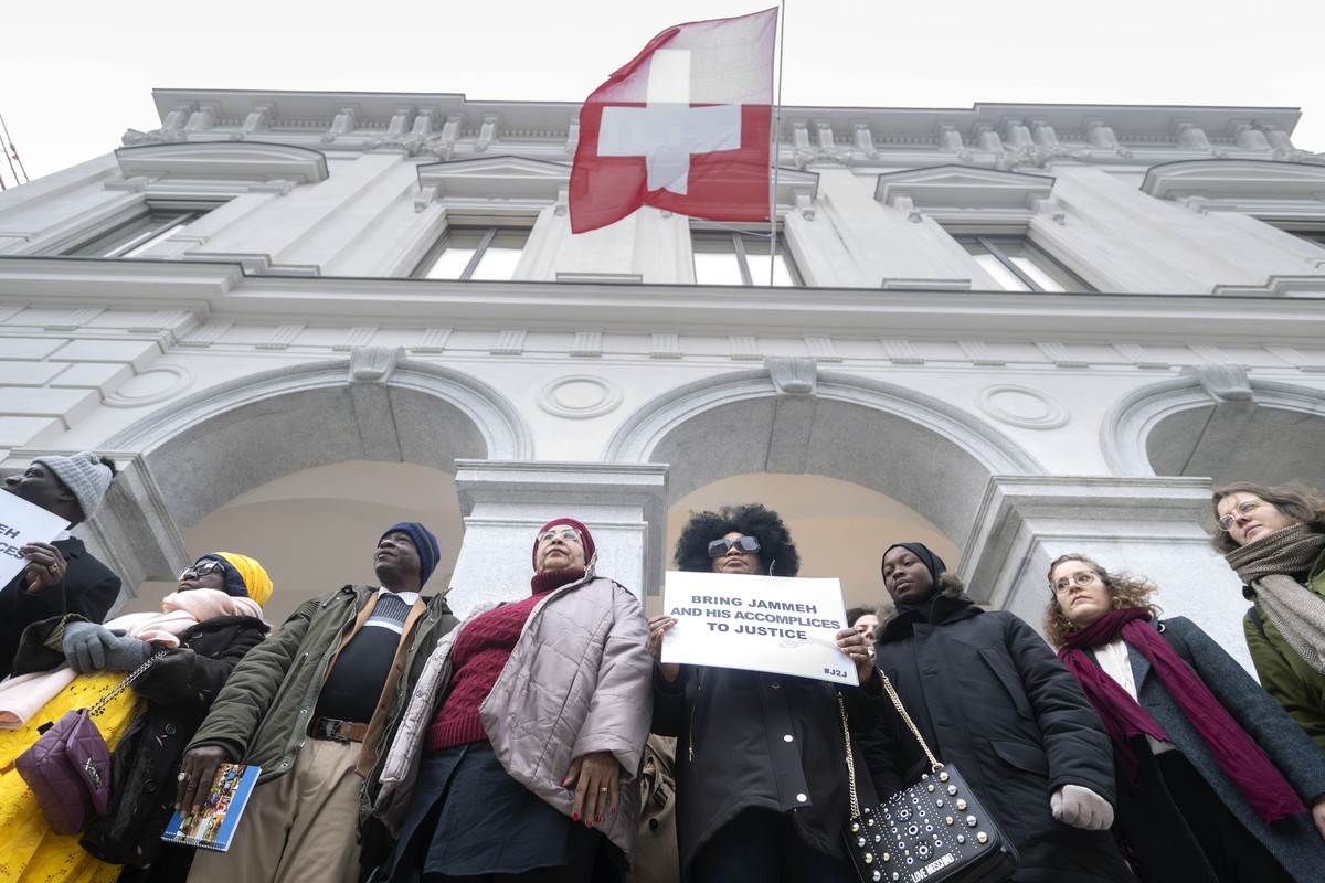 epa11064080 Victims and their relatives demonstrate in front of the Federal Criminal Court of Switzerland before the beginning of the trial against Gambia's former Interior Minister Ousman Sonko  ...