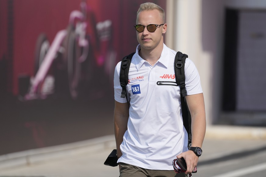FILE - Haas driver Nikita Mazepin of Russia arrives to the Losail International Circuit in Losail, Qatar, Thursday, Nov. 18, 2021 ahead of the Qatar Formula One Grand Prix. Auto racing&#039;s internat ...