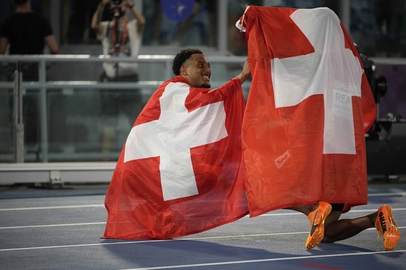 Gold medal Timoth� Mumenthaler, of Switzerland, left, celebrates with bronze medal William Reais, of Switzerland, after the the men&#039;s 200 meters final at the the European Athletics Championships  ...