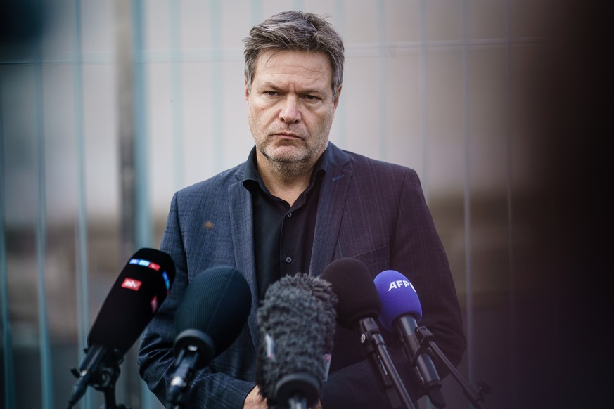 epa10295971 German Minister for Economy and Climate Robert Habeck looks on during a press statement in front of the Chancellery in Berlin, Germany, 09 November 2022. Habeck addressed the media after a ...