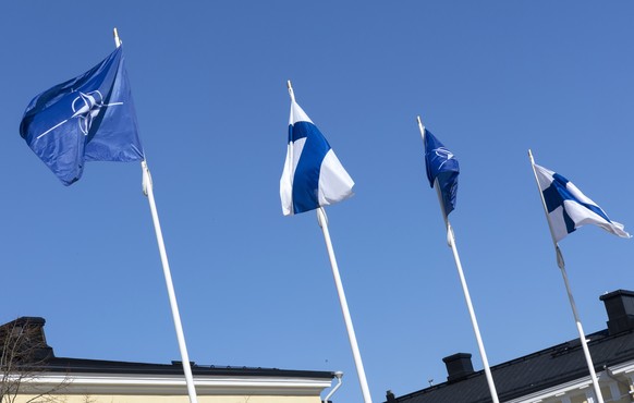 epa10558099 Finland&#039;s and NATO&#039;s flags fly in front of the Finnish Foreign Ministry building in Helsinki, Finalnd, 04 April 2023. Finland becomes the 31st member of the North Atlantic Treaty ...