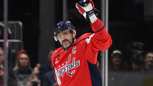 Washington Capitals left wing Alex Ovechkin (8) celebrates his 900th career NHL goal during the second period of an NHL hockey game against the St. Louis Blues, Wednesday, Nov. 5, 2025, in Washington. ...