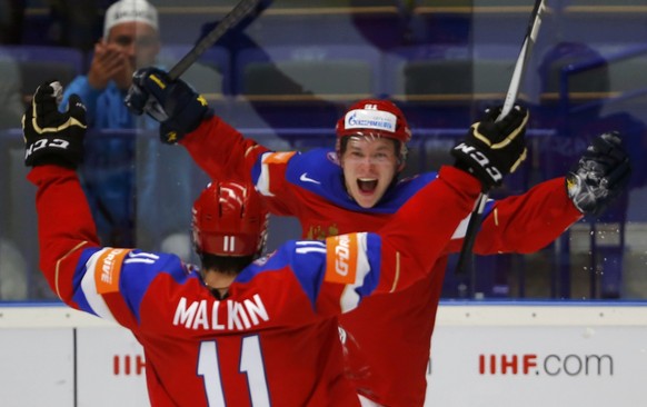 Russia&#039;s Vladimir Tarasenko (R) celebrates his goal against Sweden with team mate Yevgeni Malkin during their Ice Hockey World Championship quarterfinals game at the CEZ arena in Ostrava, Czech R ...