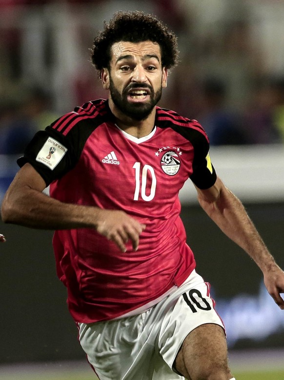 FILE - In this Oct. 8, 2017 file photo, Egypt&#039;s Mohamed Salah, center, battles for the ball with Congo&#039;s Delvin N&#039;Dinga, right, and Tobias Badila during the 2018 World Cup group E quali ...
