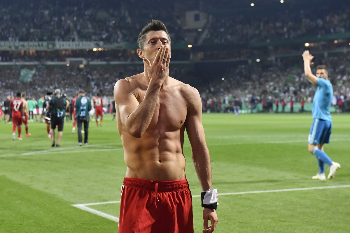 Bayern's Robert Lewandowski celebrates his team's 3-2 win after the German soccer cup, DFB Pokal, semifinal match between Werder Bremen and Bayern Munich at the Weser stadium in Bremen, Germ ...