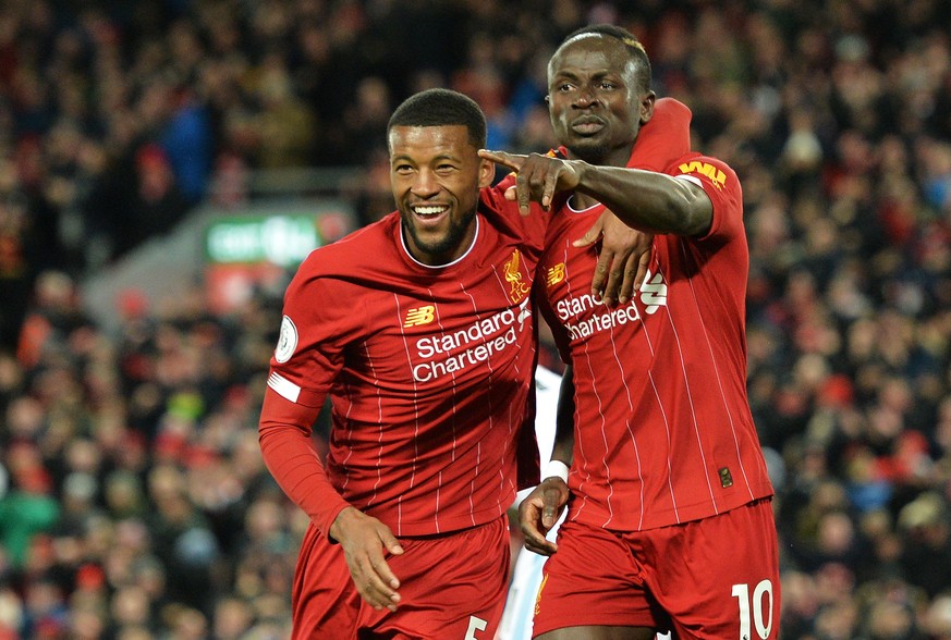 epa08245192 Sadio Mane (R) of Liverpool celebrates with teammate Georginio Wijnaldum after scoring his team&#039;s fourth goal which was disallowed for offside during the English Premier League match  ...