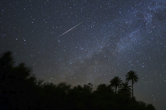 epa05476317 A meteorite from the Perseida swarm of meteorites burns up in the atmosphere over the island of Fuerteventura, in Canarias, southwest Spain, August 12, 2016. The Perseid meteor shower is every ...