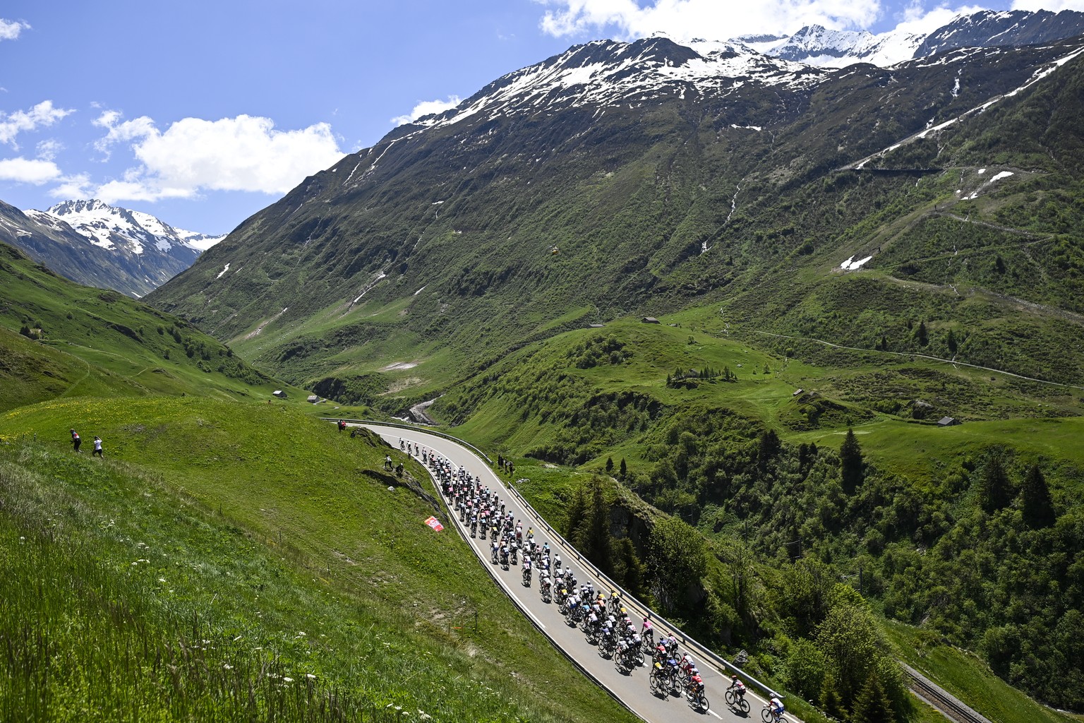 The peloton climbs towards Oberalp pass during the eight and final stage, a 160 km race with start and finish in Andermatt, at the 84th Tour de Suisse UCI ProTour cycling race, on Sunday, June 13, 202 ...