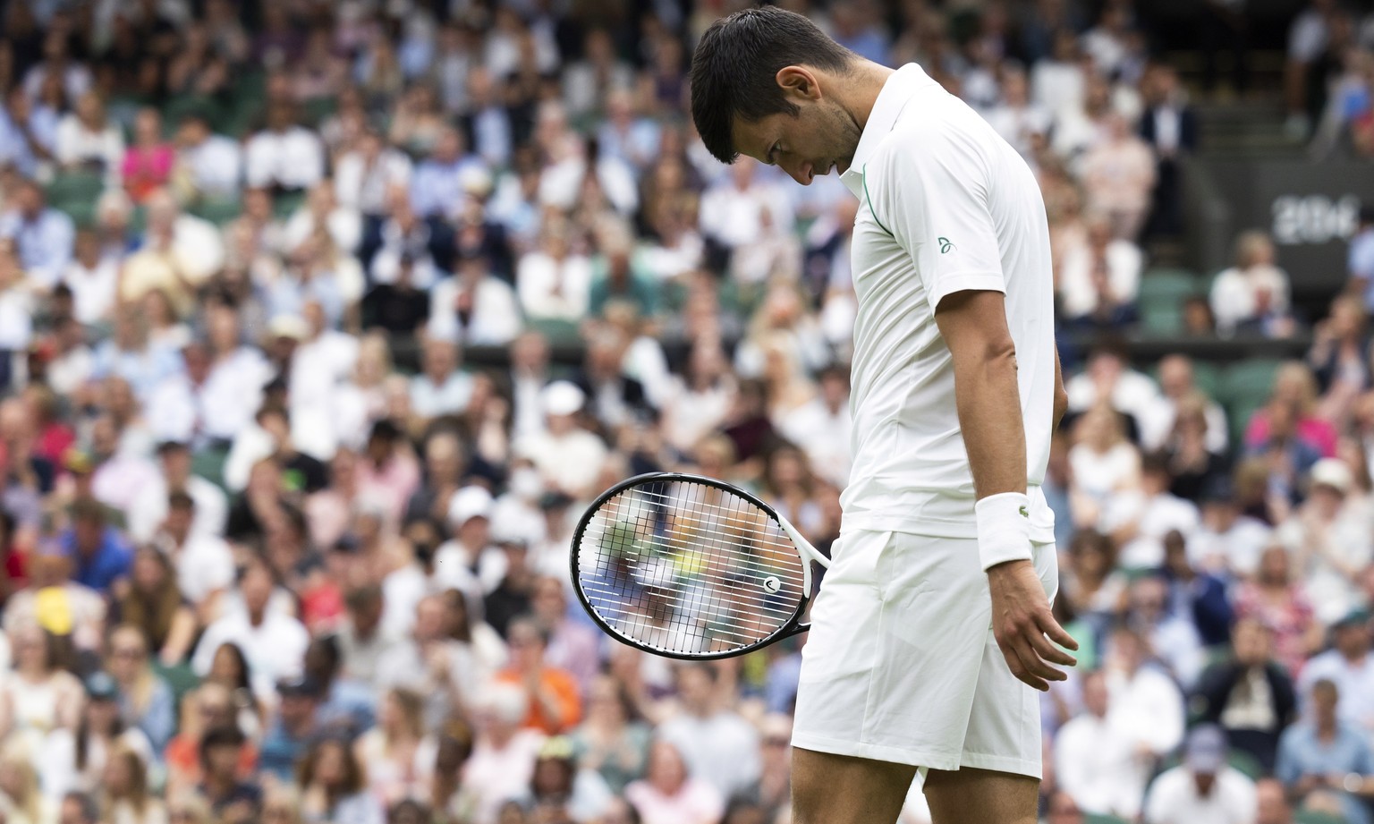 Novak Djokovic of Serbia reacts during his first round match against Kwon Soon-woo of South Korea, at the All England Lawn Tennis Championships in Wimbledon, London, Monday, June 27, 2022. (KEYSTONE/P ...
